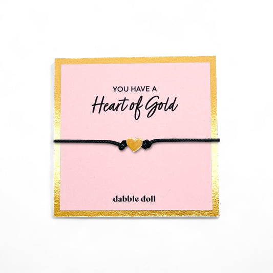 Heart bracelet in vibrant yellow on a black cord, ideal gift for girls and women from Dabble Doll