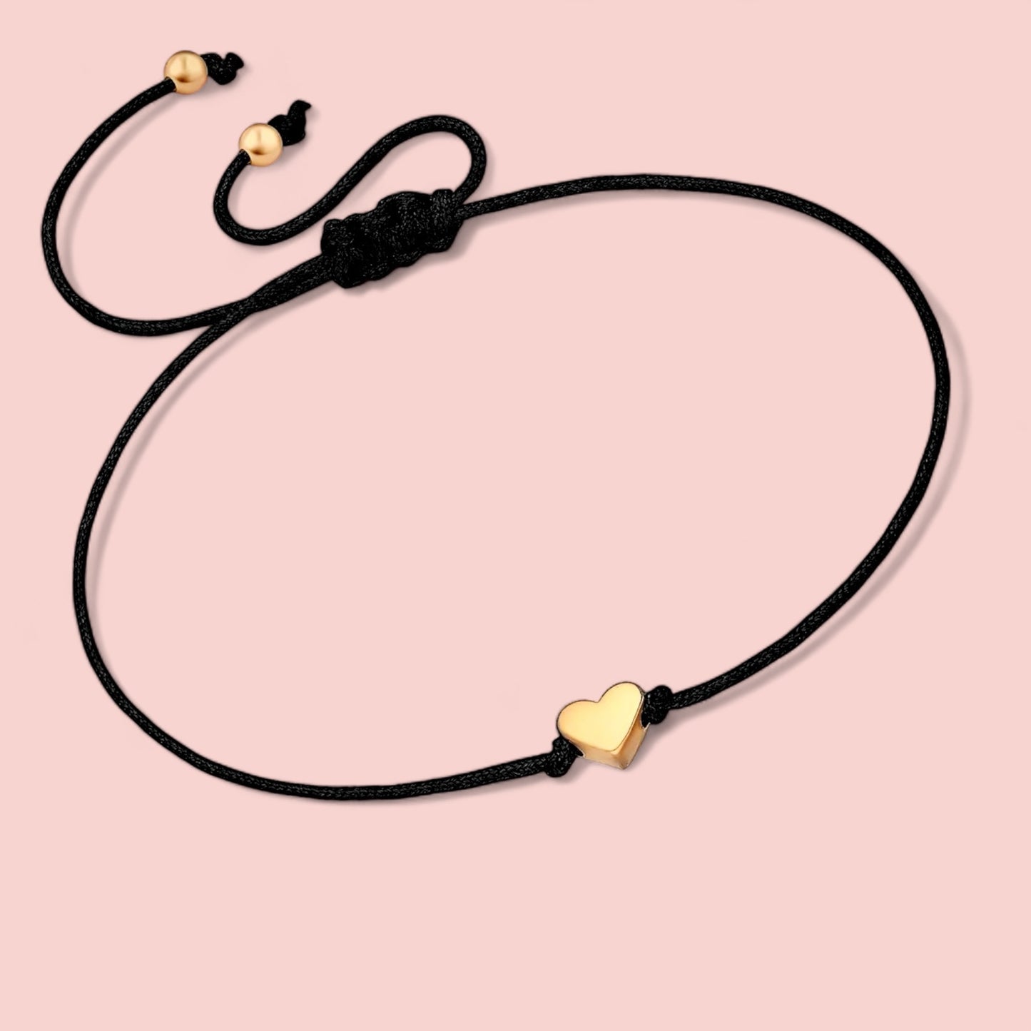 Dabble Doll heart bracelet in black cord with gold heart charm, perfect gift for girls and women