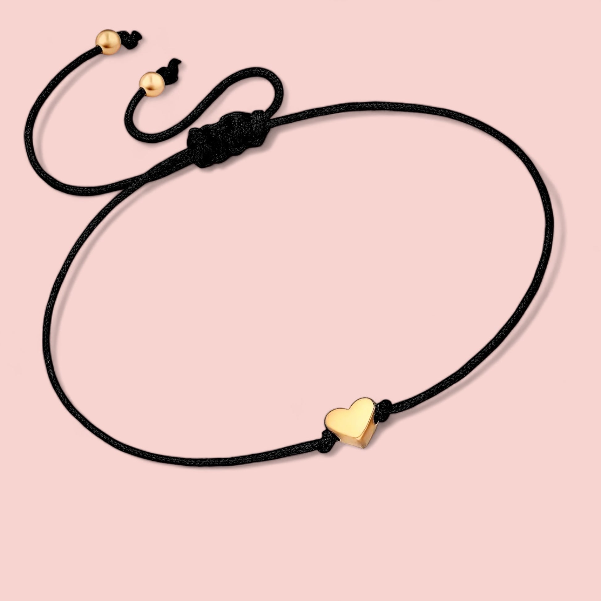 Dabble Doll heart bracelet in black cord with gold heart charm, perfect gift for girls and women