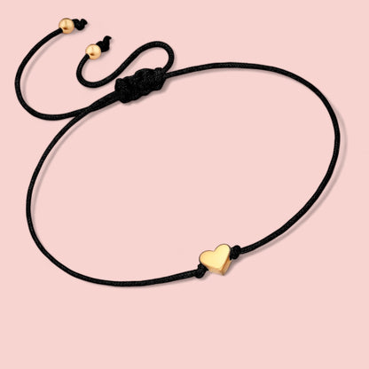 Dabble Doll heart bracelet in black cord with gold heart charm, perfect gift for girls and women