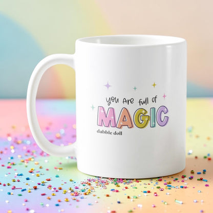Dabble Doll magic mug with colorful text saying You Are Full of Magic on a confetti background