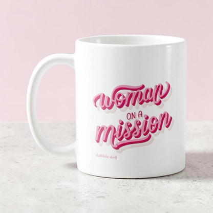 Dabble Doll novelty mug featuring the phrase Woman on a Mission in pink lettering