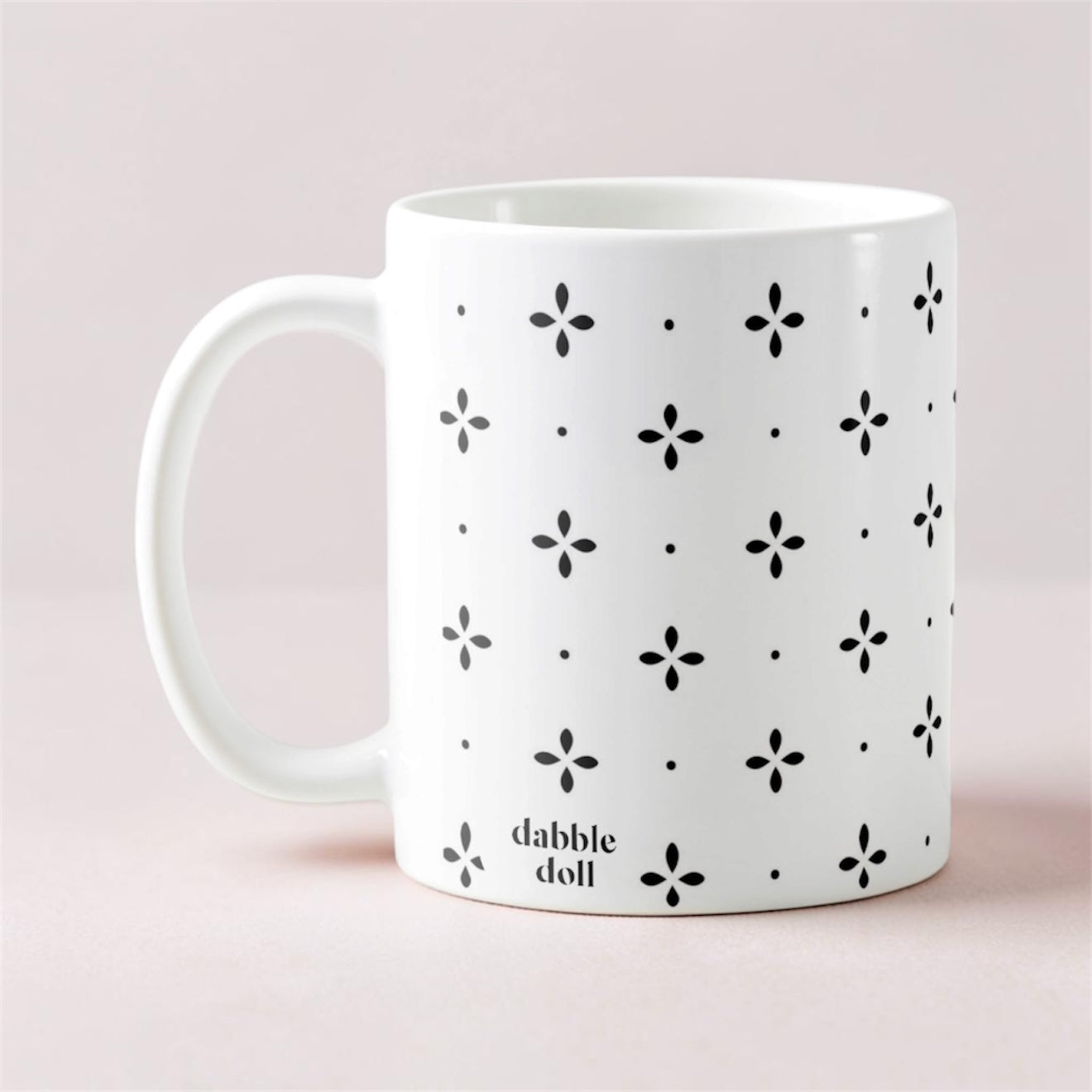 Dabble Doll gift box containing a patterned coffee mug with a unique design