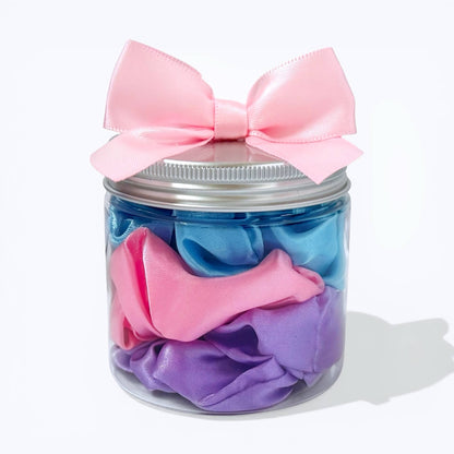 Dabble Doll colorful scrunchie set in a jar with a pink bow for stylish hair accessories