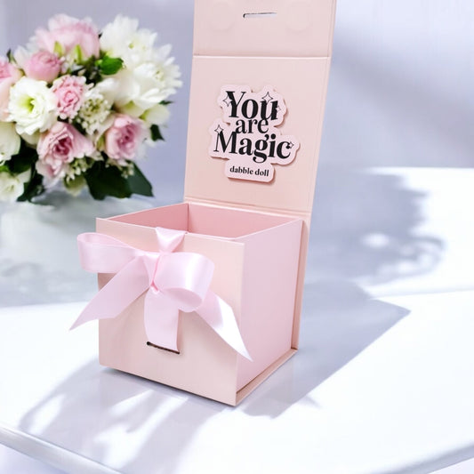 Dabble Doll pink smiles jar gift box with ribbon bow and You are Magic message inside lid