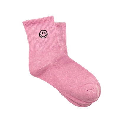 Dabble Doll Pink Socks featuring a smiley face design for a cheerful look