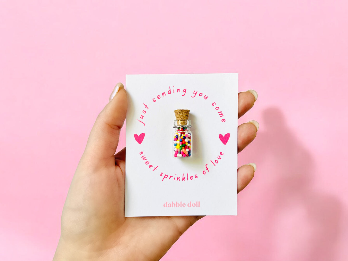 Colorful glass bottle filled with sprinkles, designed for girls and women by Dabble Doll