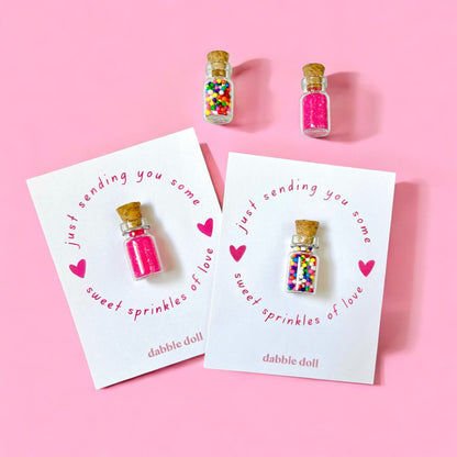 Dabble Doll colorful sprinkles in glass bottles on greeting cards, perfect for girls and women