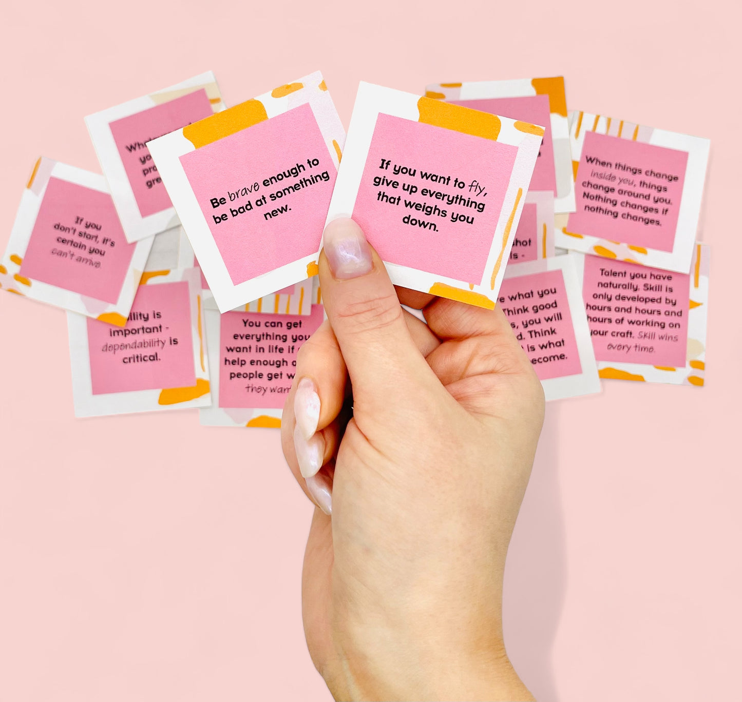 Hand holding motivational cards from Dabble Doll success motivation jar gift box with inspiring quotes