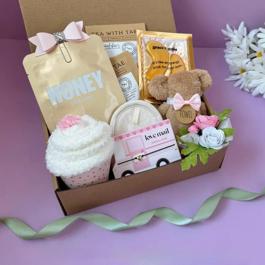 Dabble Doll thinking of you care package for women with plush bear towel honey mask and flower accessories