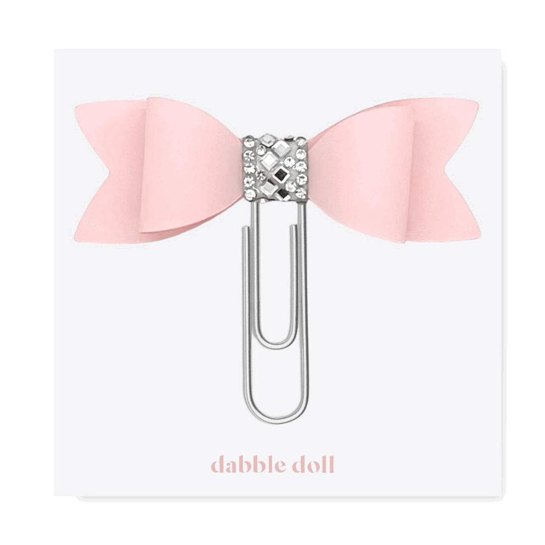 Pink bow paperclip with rhinestone detail from Dabble Doll in thinking of you care package for women