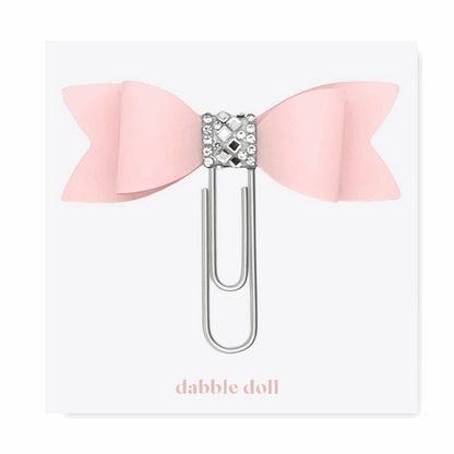 Pink bow paperclip with rhinestone detail from Dabble Doll in thinking of you care package for women
