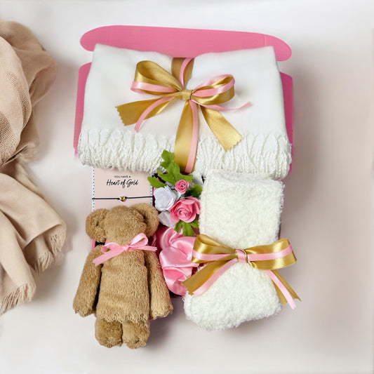 Dabble Doll thinking of you gift box for her with plush bear, white blankets, and pink flowers
