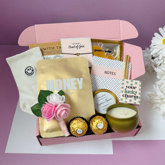 Dabble Doll gift box featuring sweet treats and thoughtful items, perfect for saying thinking of you.