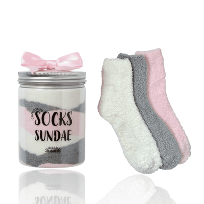 Dabble Doll Cozy Socks gift set with three pairs in soft colors, presented in a sundae jar
