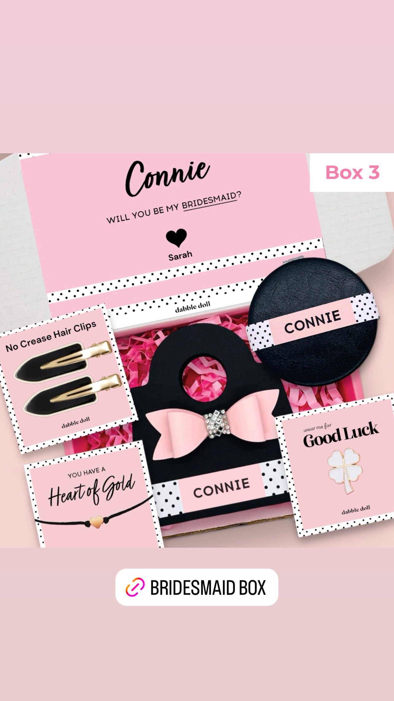 Dabble Doll gift box in pink and black designed for women with hair clips and personalized items