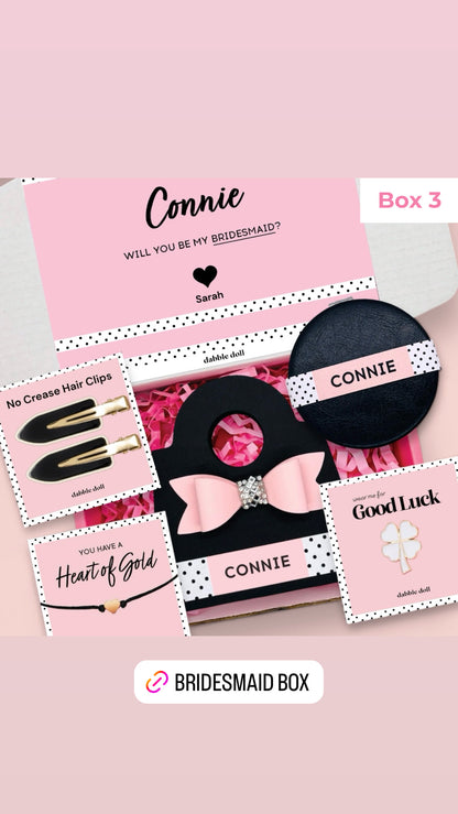 Dabble Doll gift box in pink and black designed for women with hair clips and personalized items