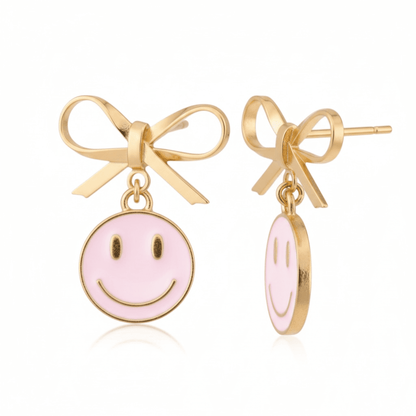 Dabble Doll Smiley Face Earrings with Pink Smiley Charm and Gold Bow for a Playful Look
