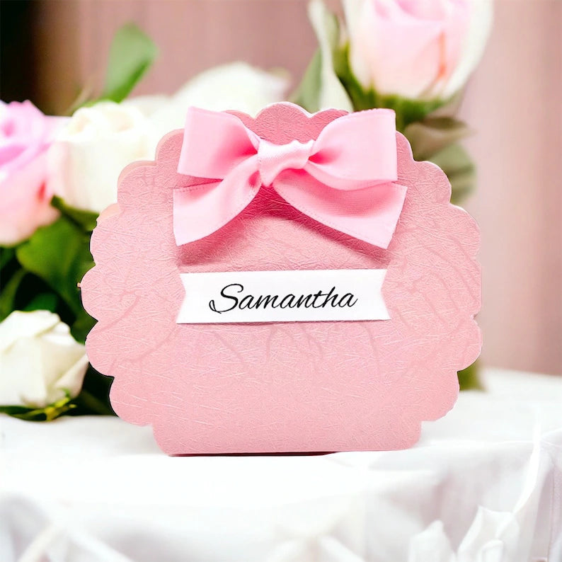 Pink favor box designed for girls with a decorative bow, perfect for gifting and special occasions
