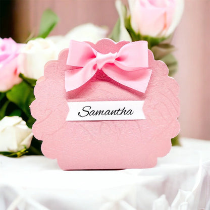 Pink favor box designed for girls with a decorative bow, perfect for gifting and special occasions