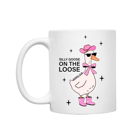 Funny coffee mug featuring a cartoon goose in pink boots and sunglasses with the phrase Silly Goose On The Loose