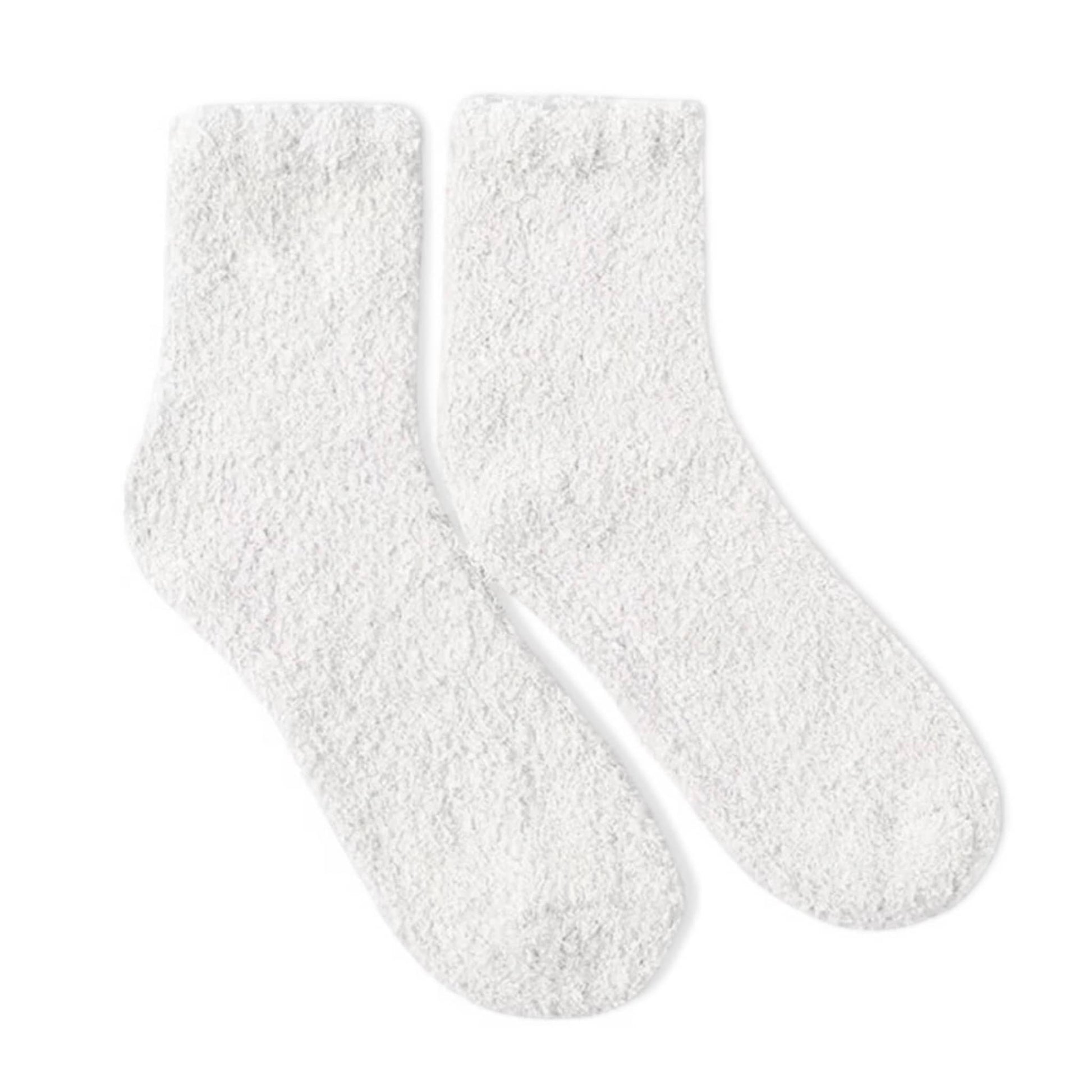 Soft white fuzzy socks by Dabble Doll for ultimate comfort and warmth