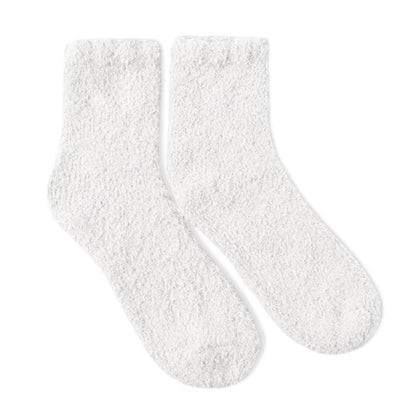 Soft white fuzzy socks by Dabble Doll for ultimate comfort and warmth