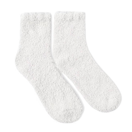 Soft white fuzzy socks by Dabble Doll for ultimate comfort and warmth