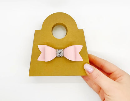 Gold Dabble Doll Gift Bag with a Pink Bow, perfect for girls and women