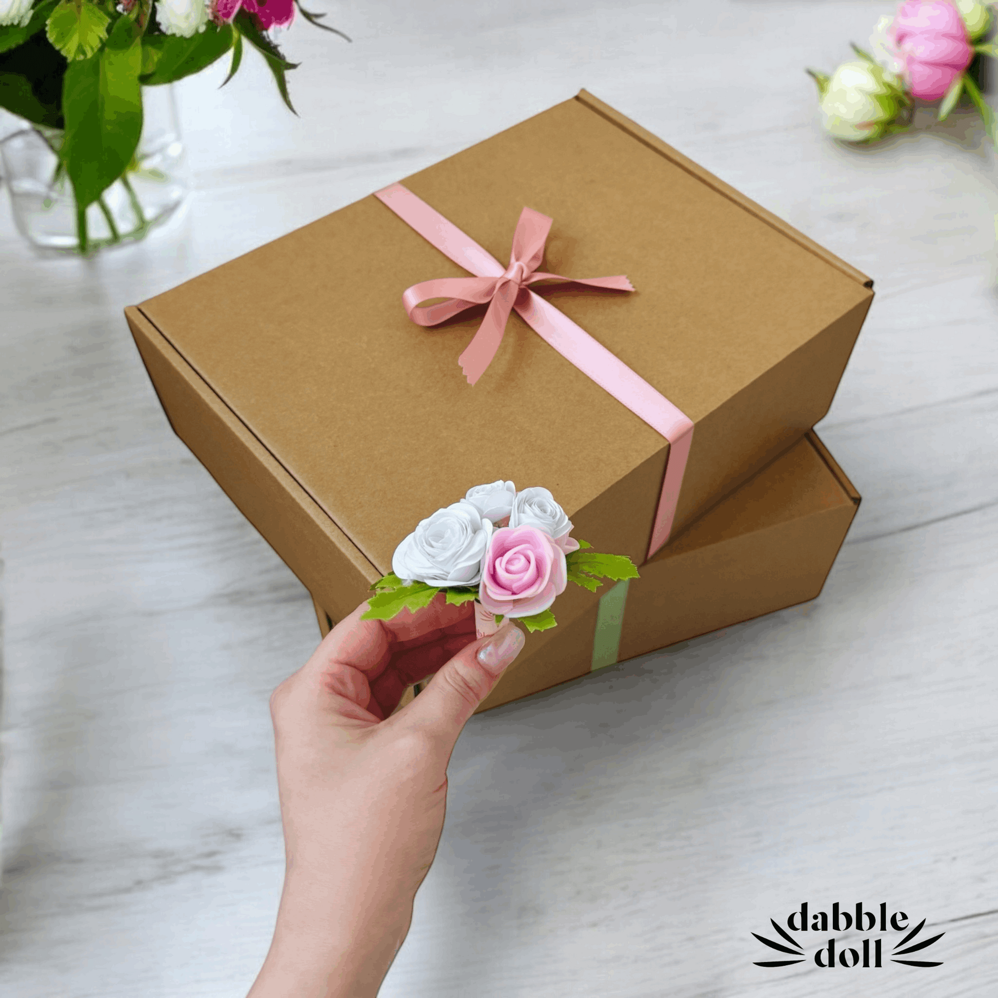 Elegant brown gift box with pastel ribbons, perfect for girls and women, crafted by Dabble Doll