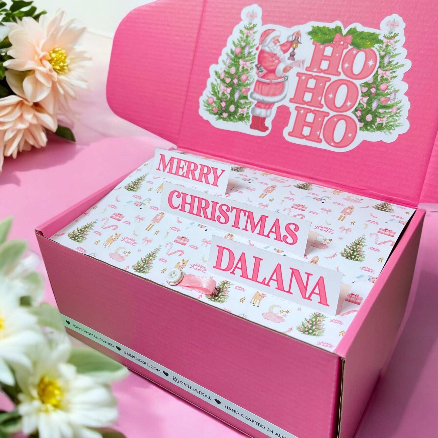Dabble Doll Christmas gift box featuring festive decorations and personalized message for holiday cheer