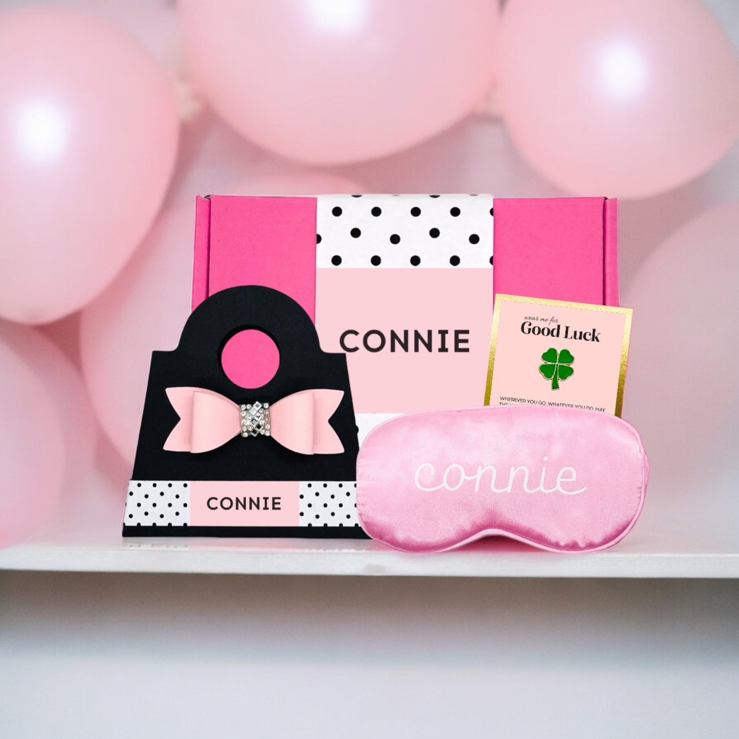 Pink Dabble Doll gift box for girls featuring a sleep mask and a charm for relaxation