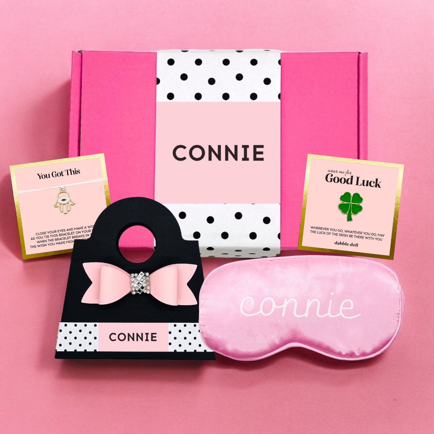 Personalized pink gift box for girls featuring a sleep mask and motivational cards from Dabble Doll