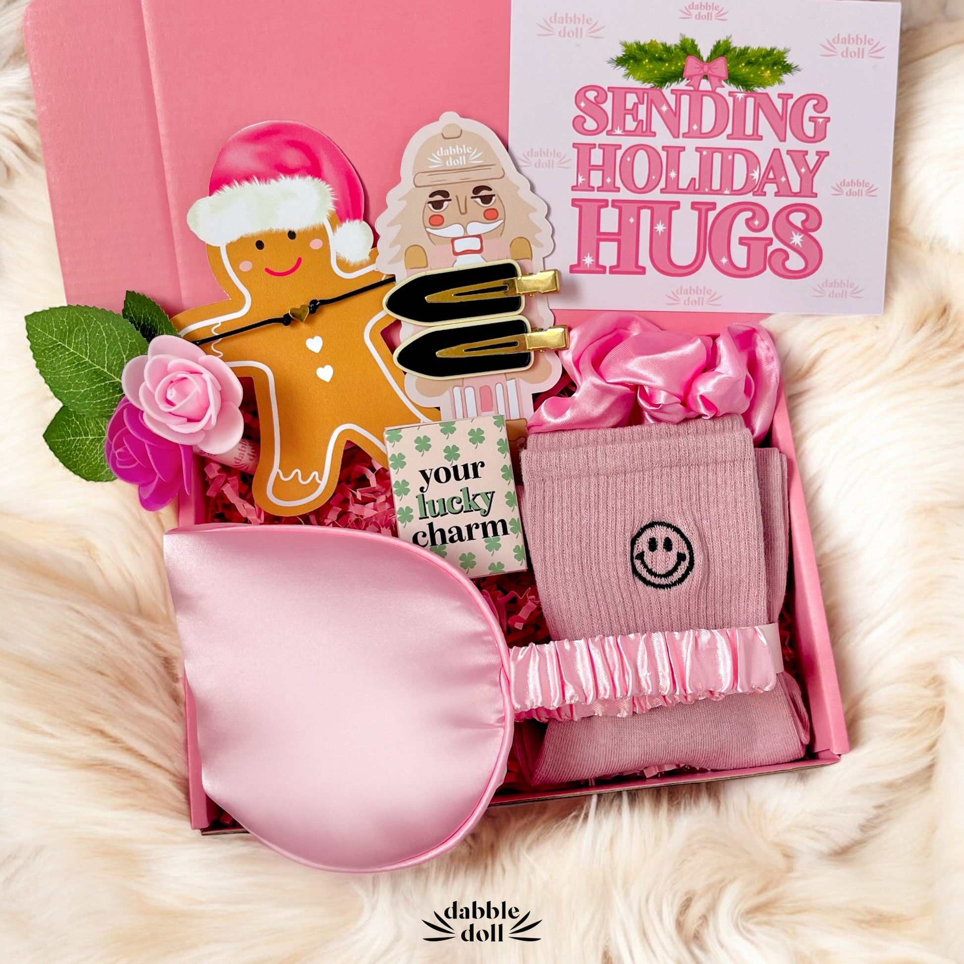 Pink Gift Box for girls with holiday-themed items, including a charming hair scrunchie and festive card