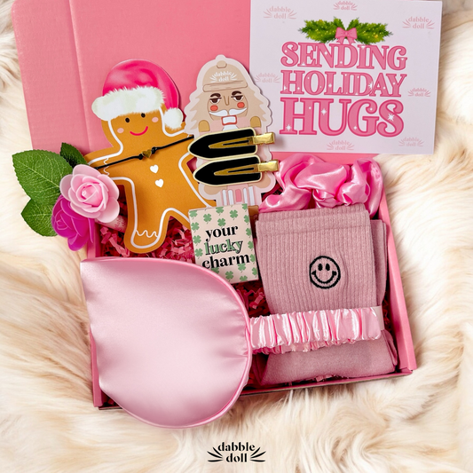 Pink Gift Box for girls with holiday-themed items, including a charming hair scrunchie and festive card
