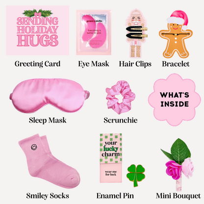 Dabble Doll pink gift box for girls featuring sleep mask, scrunchie, hair clips, and festive accessories