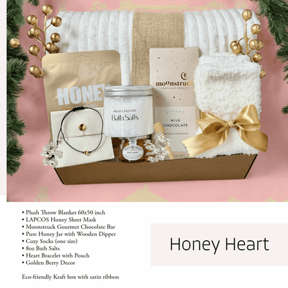 Eco-friendly gift box for women featuring a plush throw blanket, honey products, and bath essentials