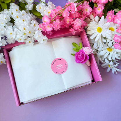 Pink Gift Box filled with white tissue paper and floral decorations, perfect for girls and women's occasions