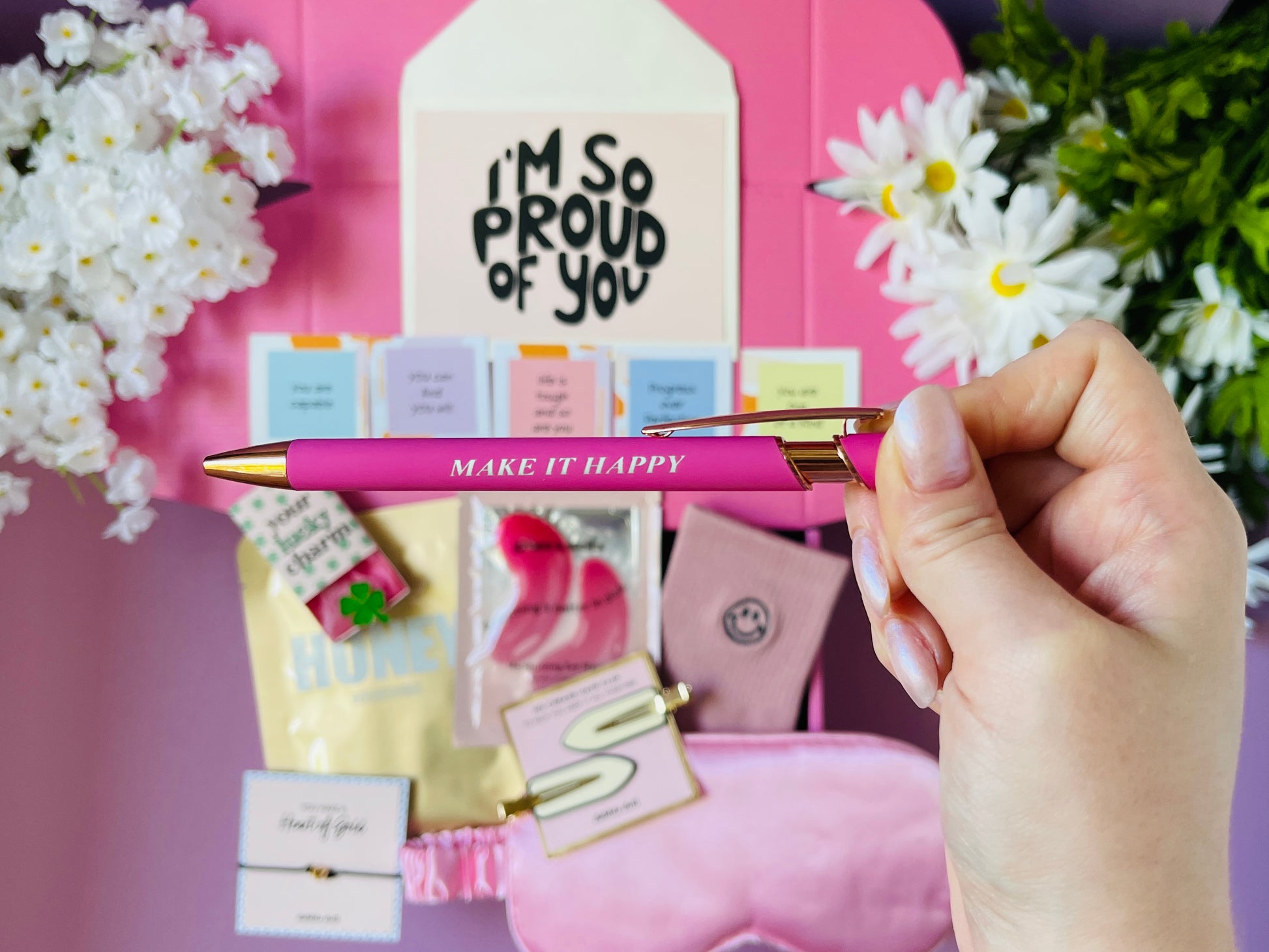Dabble Doll pink gift box for girls featuring a stylish pen and cheerful notes