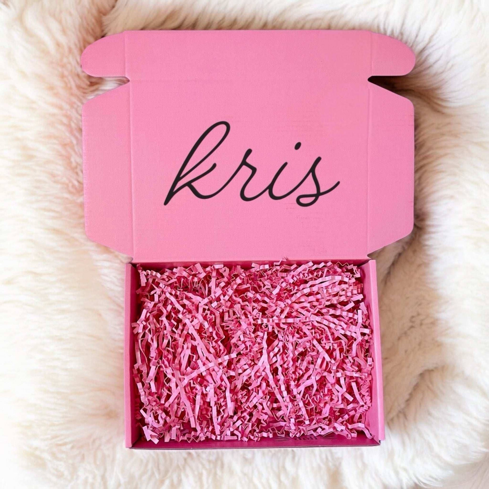Dabble Doll pink gift box filled with festive shredded paper for girls and women