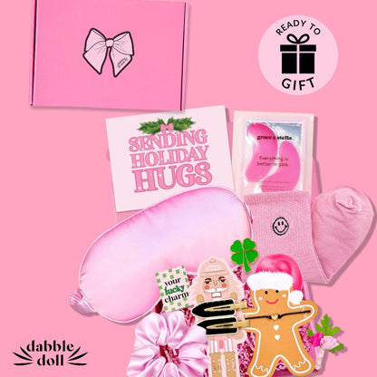 Dabble Doll pink gift box with holiday-themed items for girls and women, ready to gift.
