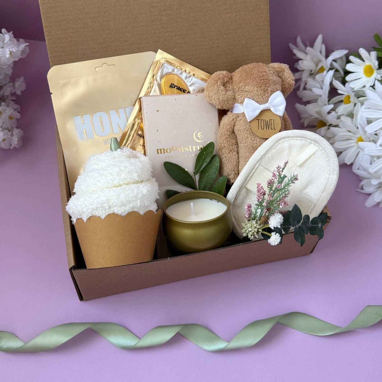 Dabble Doll Gift Box in pastel tones for girls featuring a teddy bear, candle, and spa items