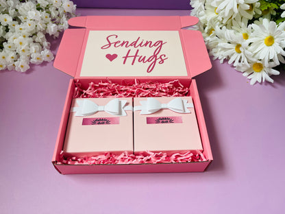 Pink gift box for girls and women featuring a Sending Hugs design with two charming gift items