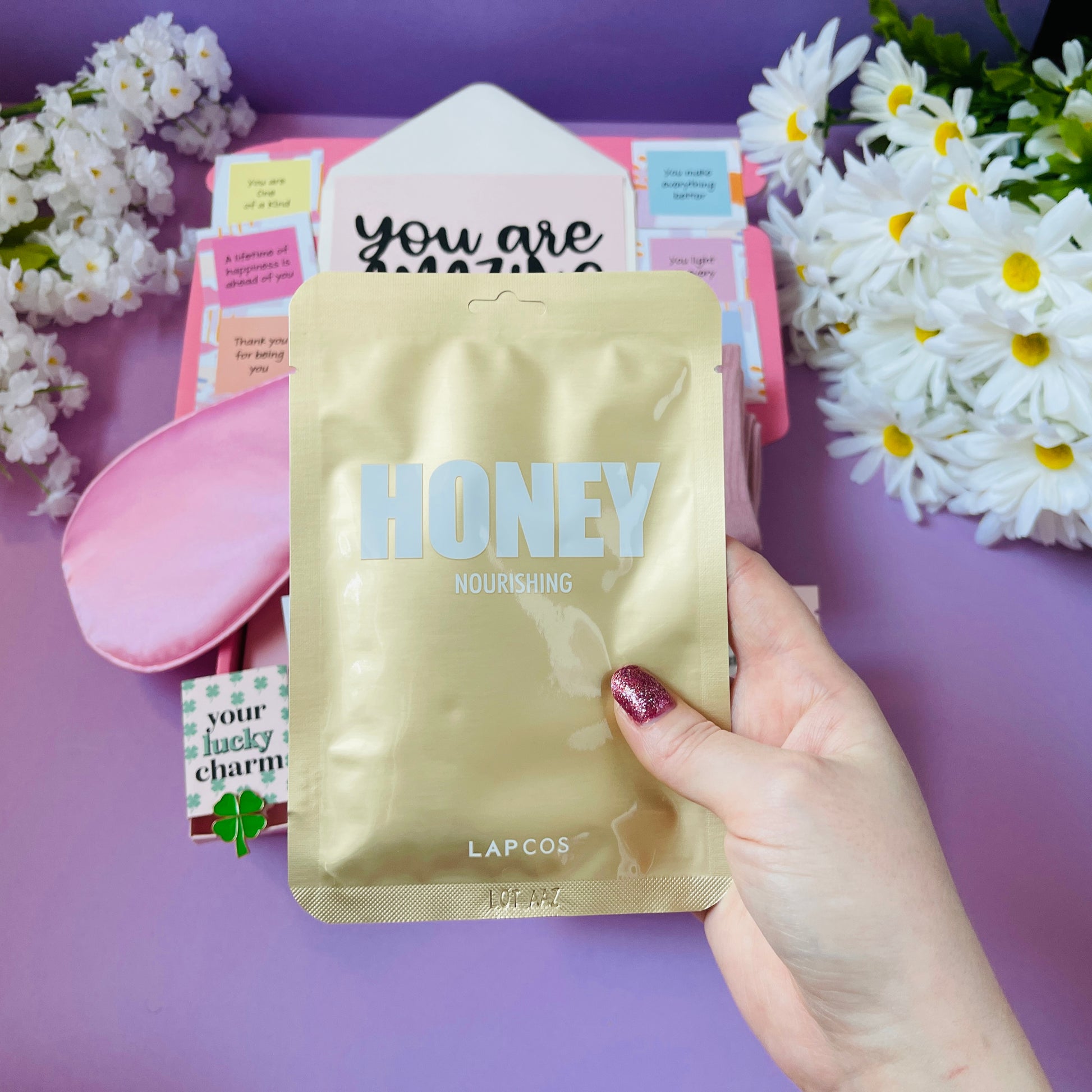 Gold Nourishing Honey Mask in a gift in box for girls, women, and ladies with floral background