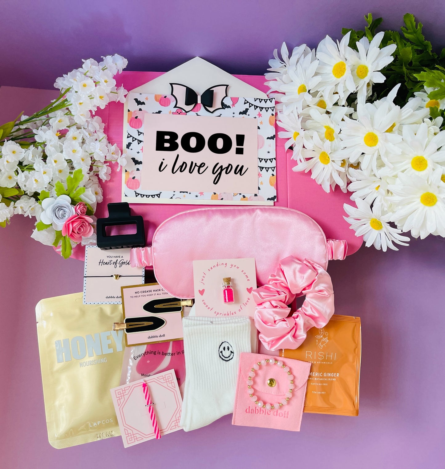 Pink Dabble Doll gift in box featuring beauty products and accessories for girls and women
