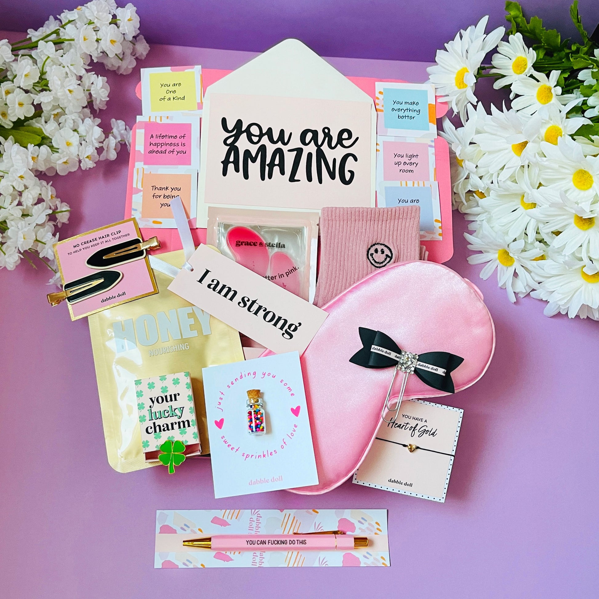 Dabble Doll gift in box for girls featuring pink accessories and empowering notes for women