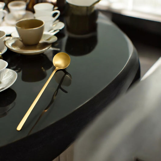 Elegant gold spoon for women, designed for serving tea and desserts with a luxurious touch