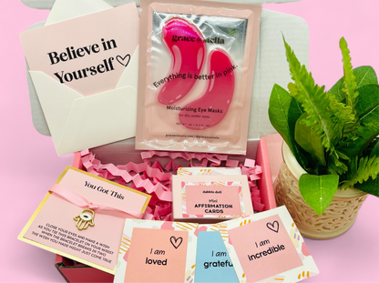 Dabble Doll Affirmation Cards and pink moisturizing eye masks for girls and women, featuring motivational messages