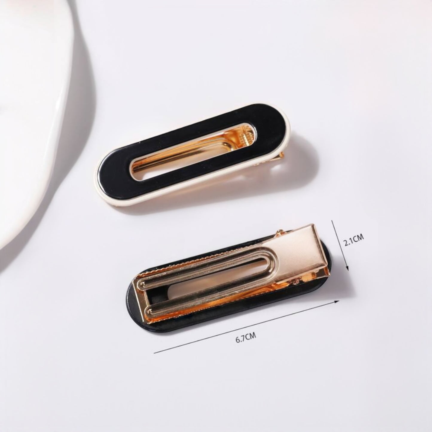 Elegant black and gold hair clips for girls and women, perfect for stylish hair accessories