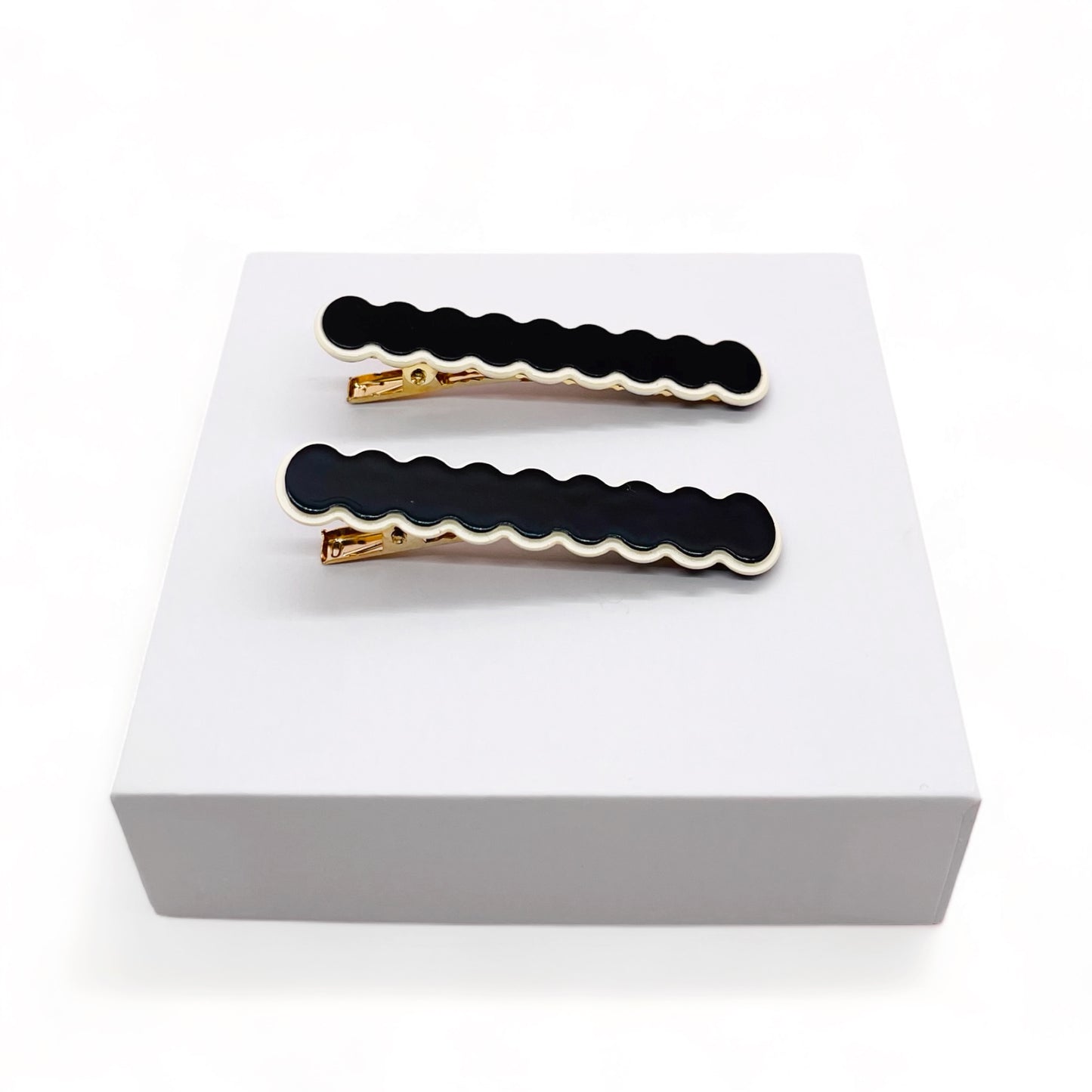 Dabble Doll black hair clips with gold accents, perfect for girls and women who love stylish accessories